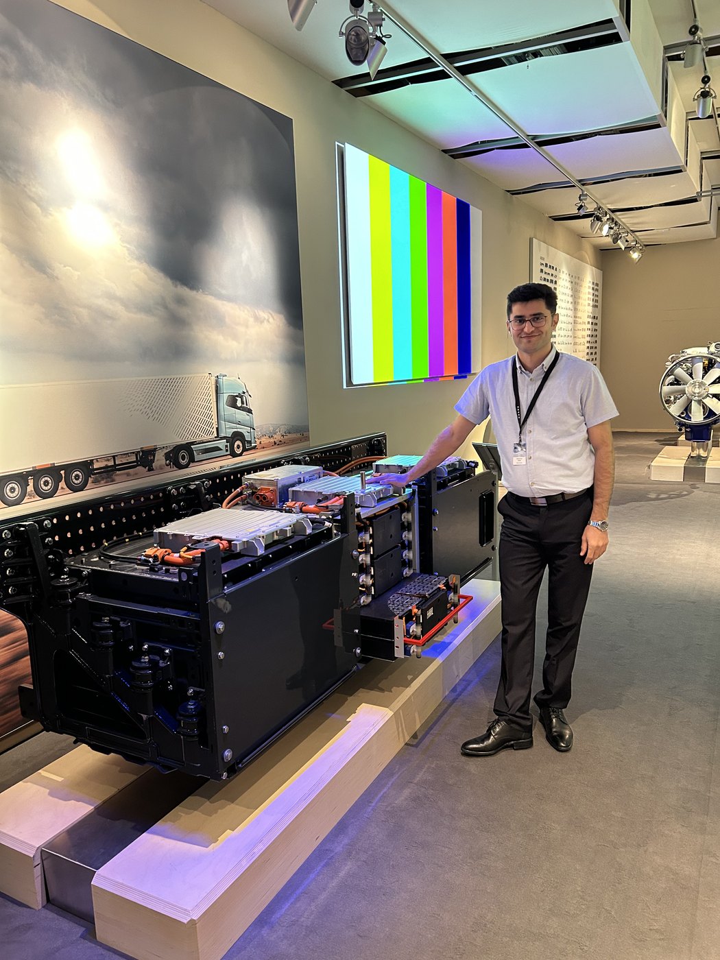 Mohammad Khalili beside an automotive battery system